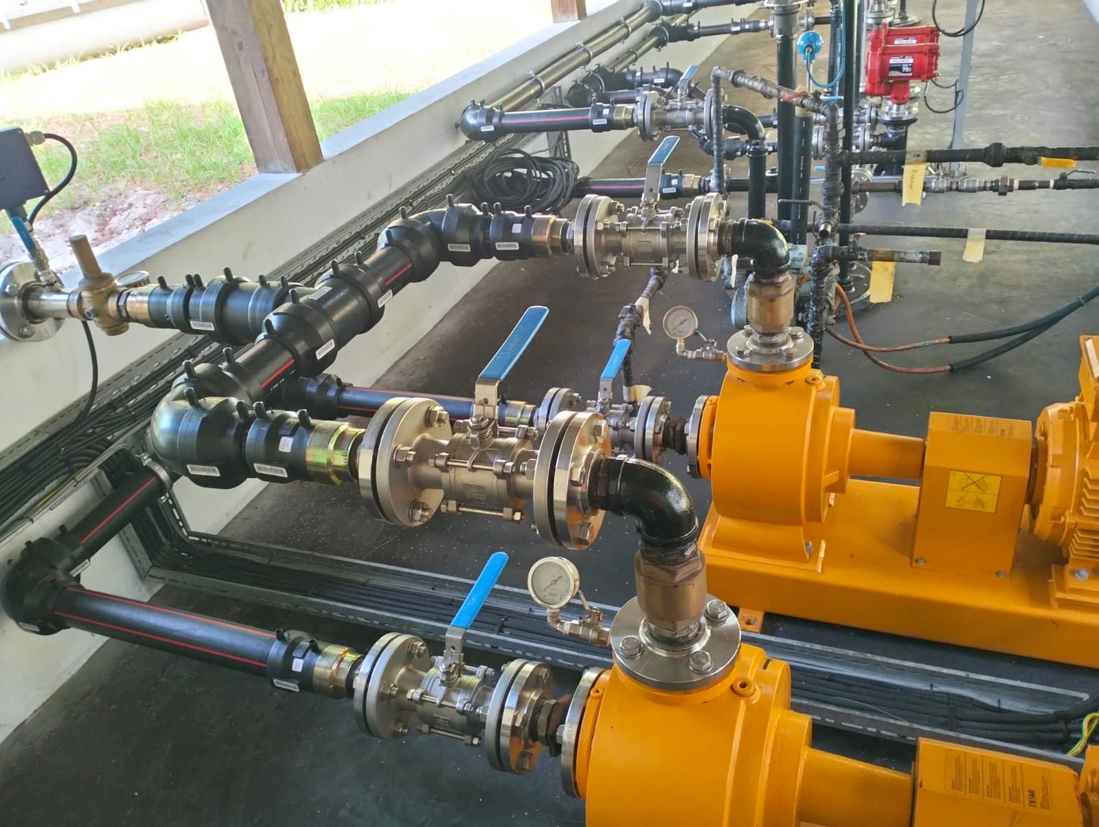 Pumping skid with HDPE piping, stainless steel ball valves, gauges and transfer pumps