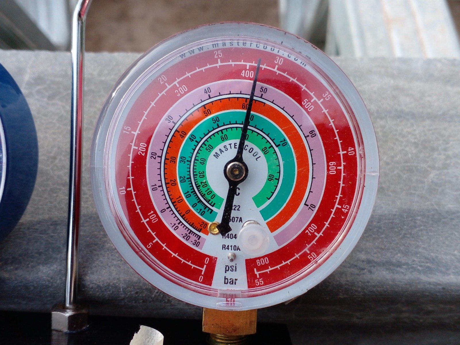 Refrigeration manifold gauge set in use during charging and pressure testing